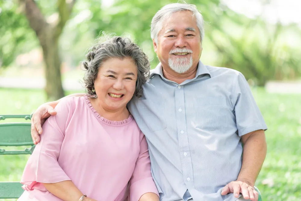 Smiling Patients Smiling older couple spending time together outdoors