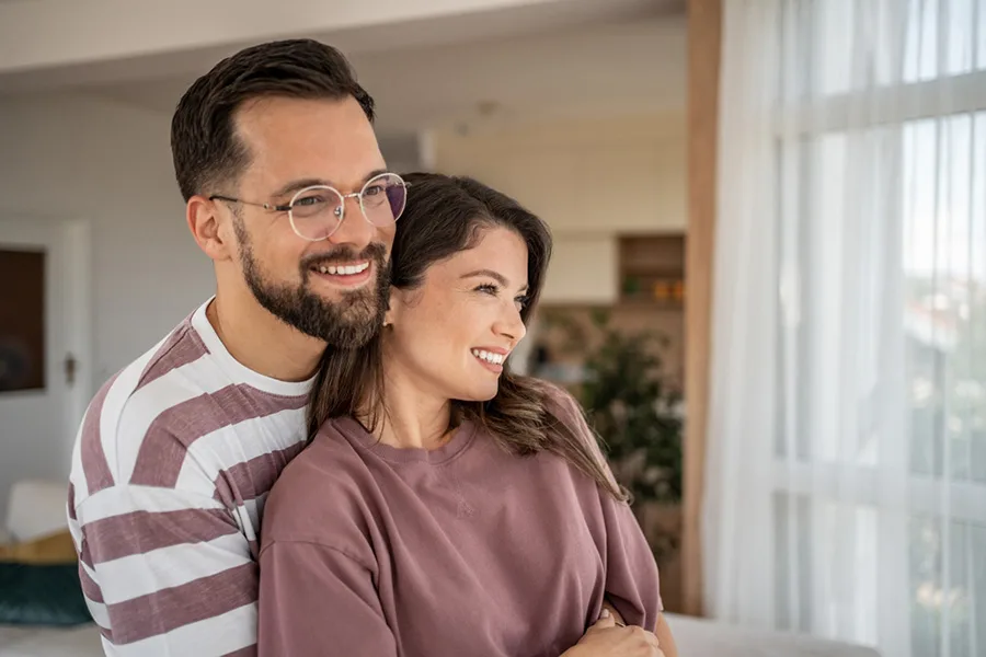 Smiling Patients Smiling couple relaxing together indoors